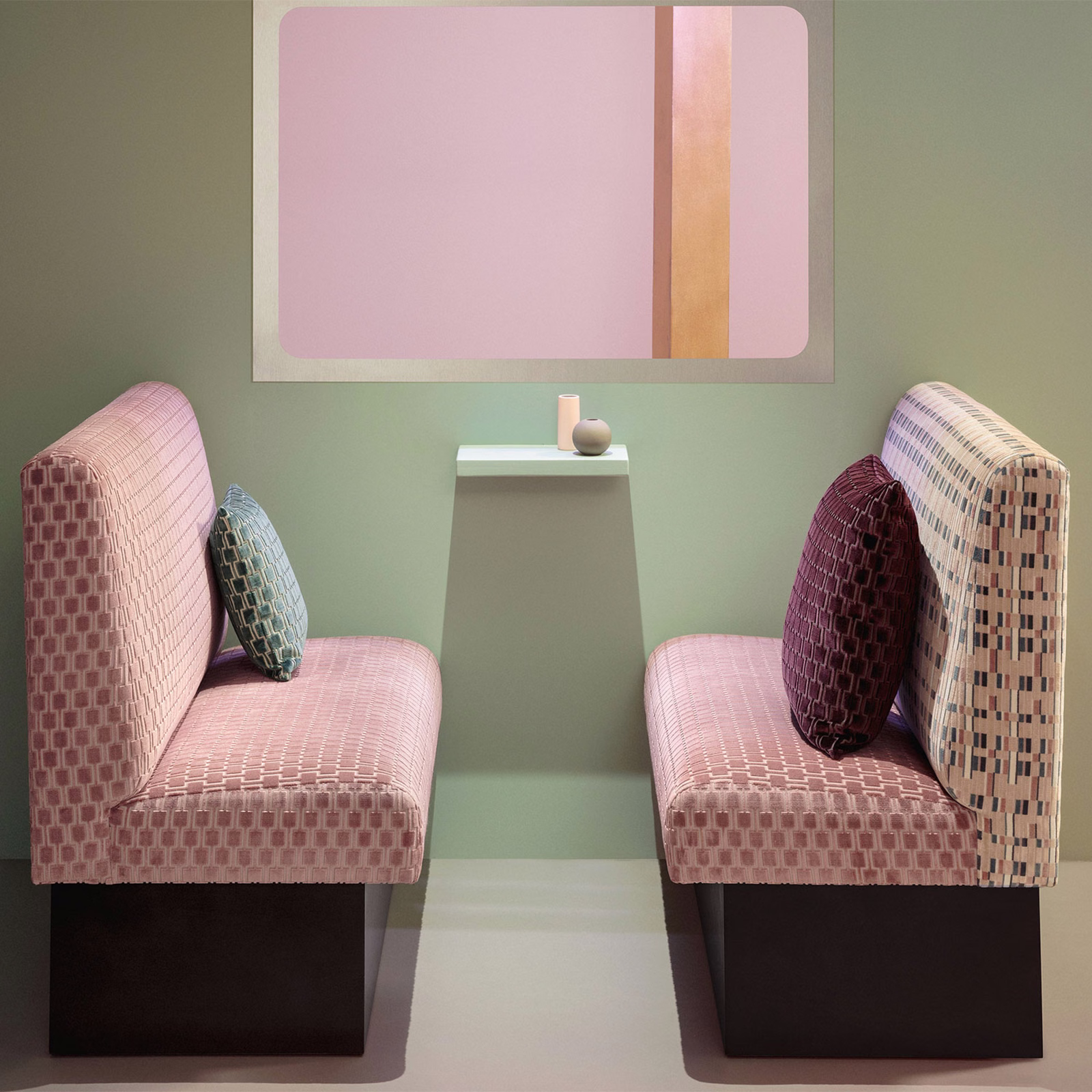 Blush pink geometric check fabric upholstered on two contemporary lounge chairs