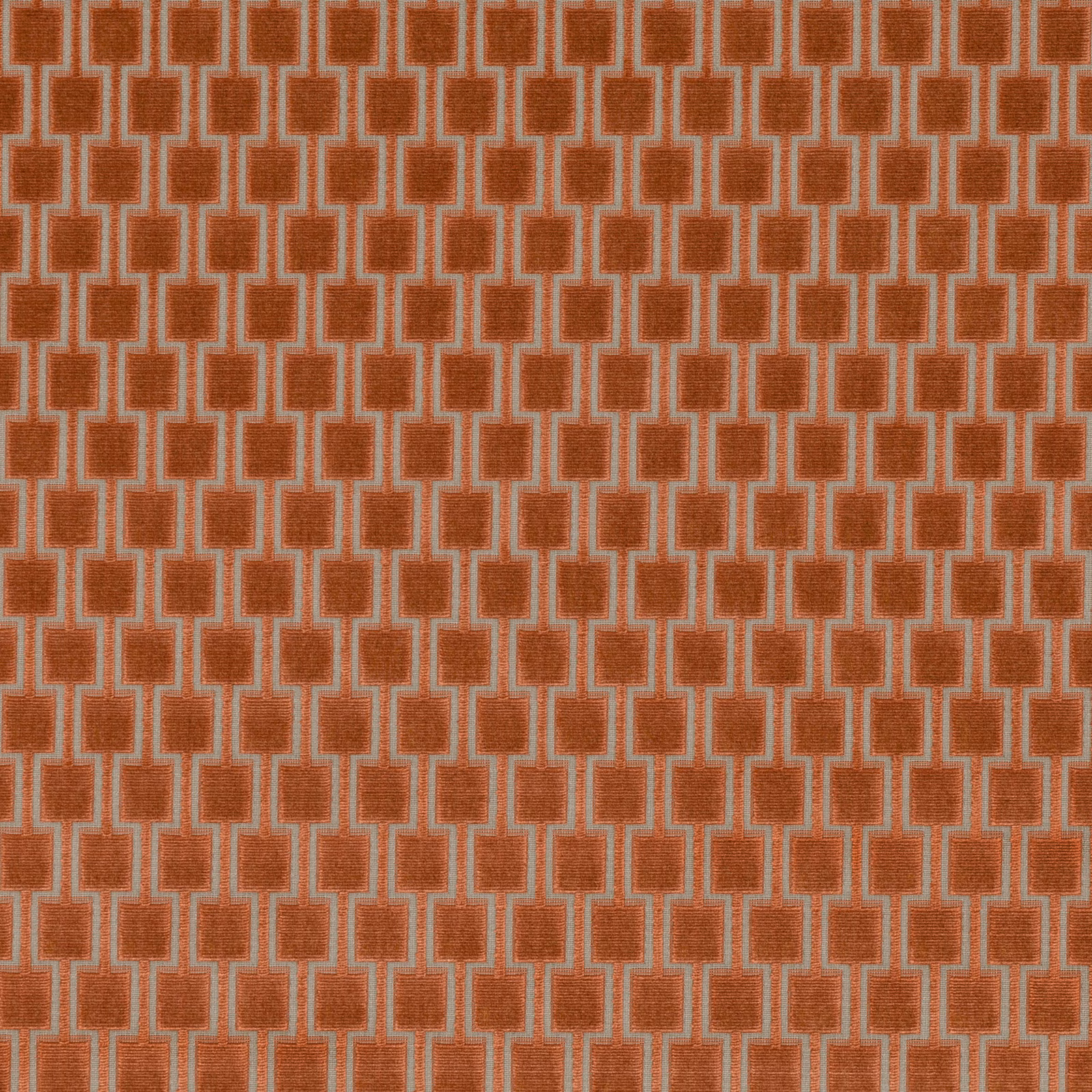 Burnt-orange woven fabric with pale interlocking rectangular geometric motifs