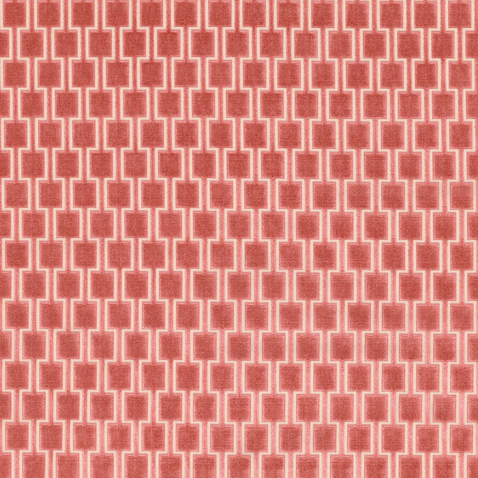 Warm coral woven fabric with repeating cream stepped geometric rectangles