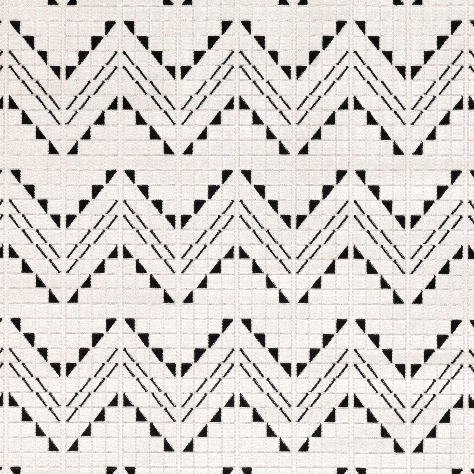 Black and ivory woven textile with repeating chevrons and fine square grid texture