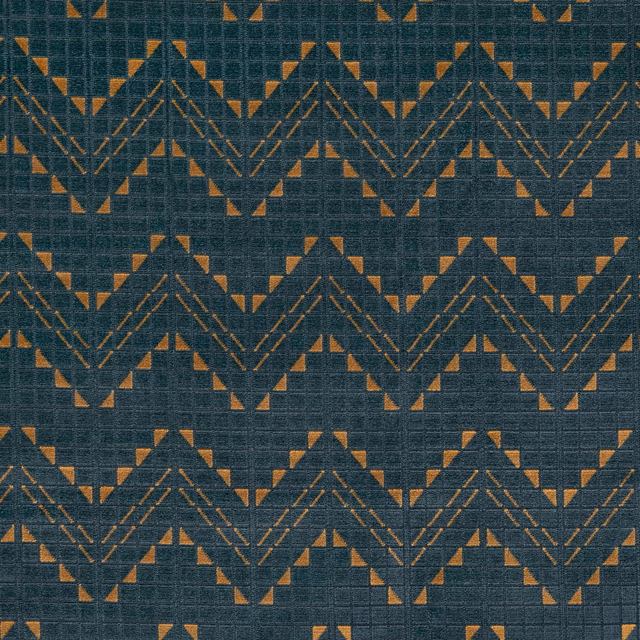 Dark petrol woven ground with rust-gold geometric chevrons and triangular accents