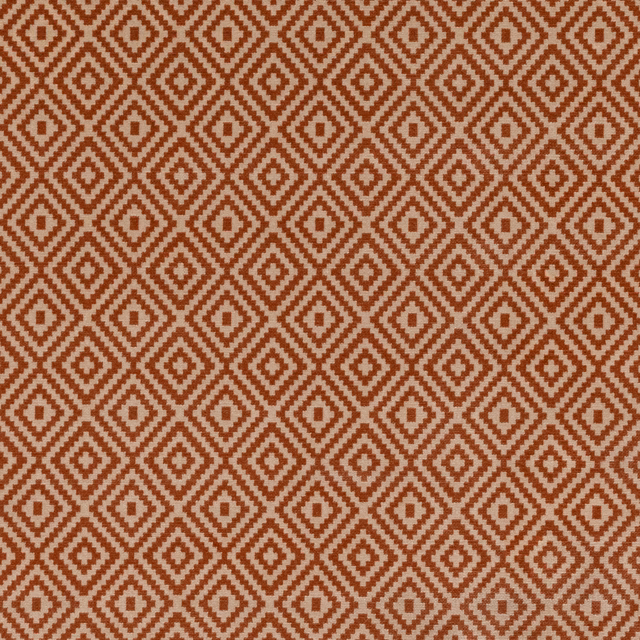 Burnt-orange and ivory woven fabric with repeating stepped diamond motifs