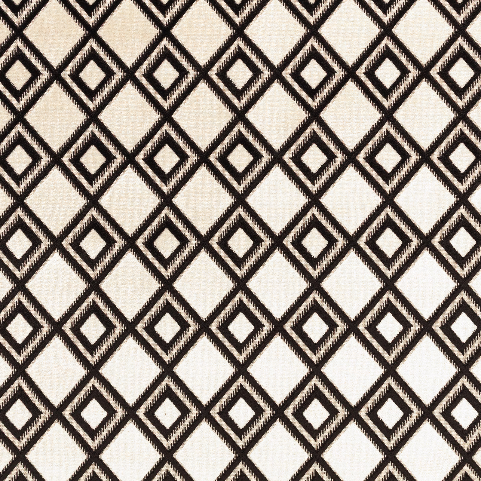 Black and ivory woven fabric with repeating nested diamond geometry