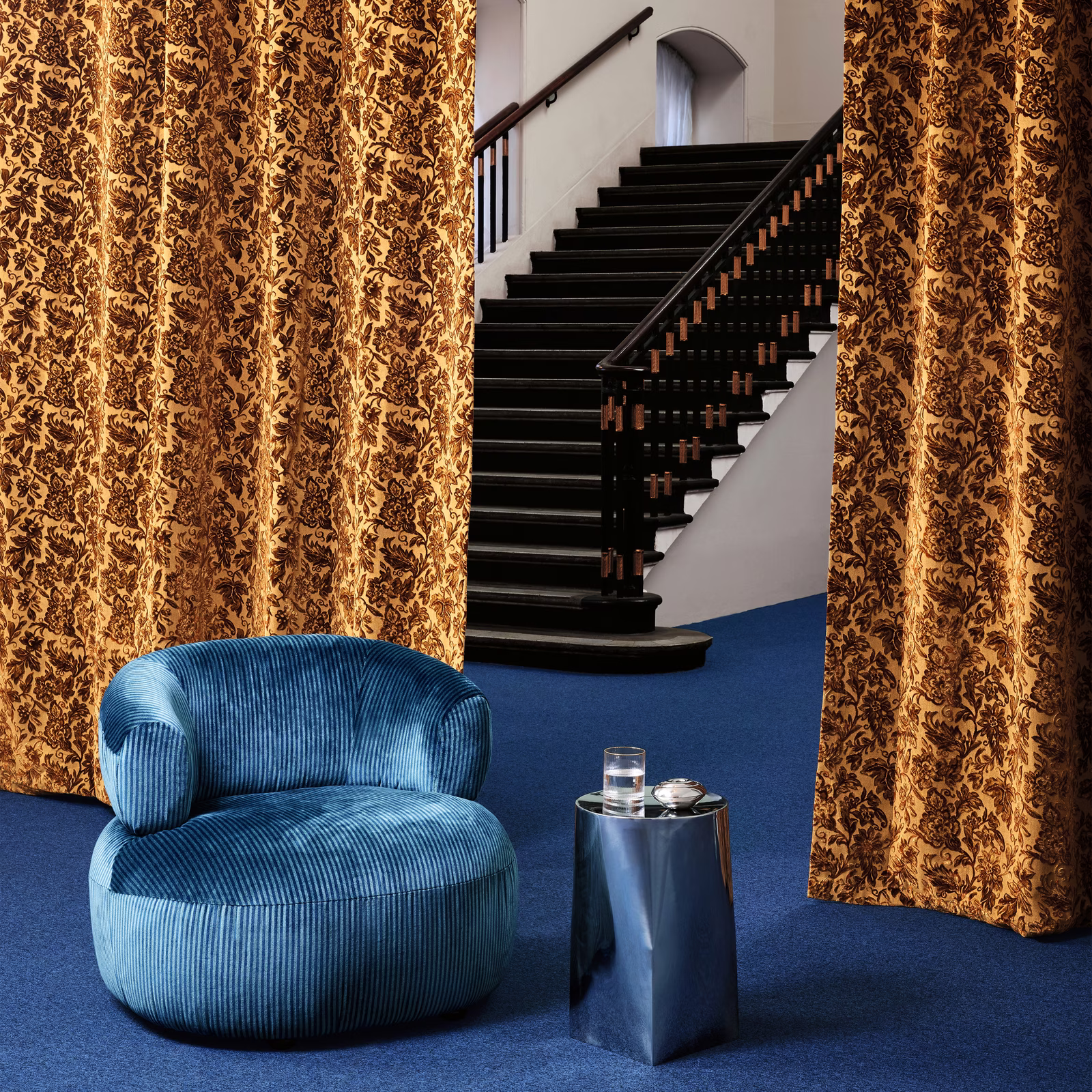 Antique gold and brown floral curtains showing Bromley Petrol’s dense vertical pattern
