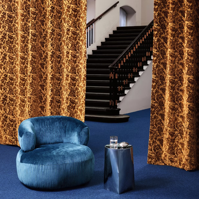 Antique gold and brown floral curtains showing Bromley Petrol’s dense vertical pattern