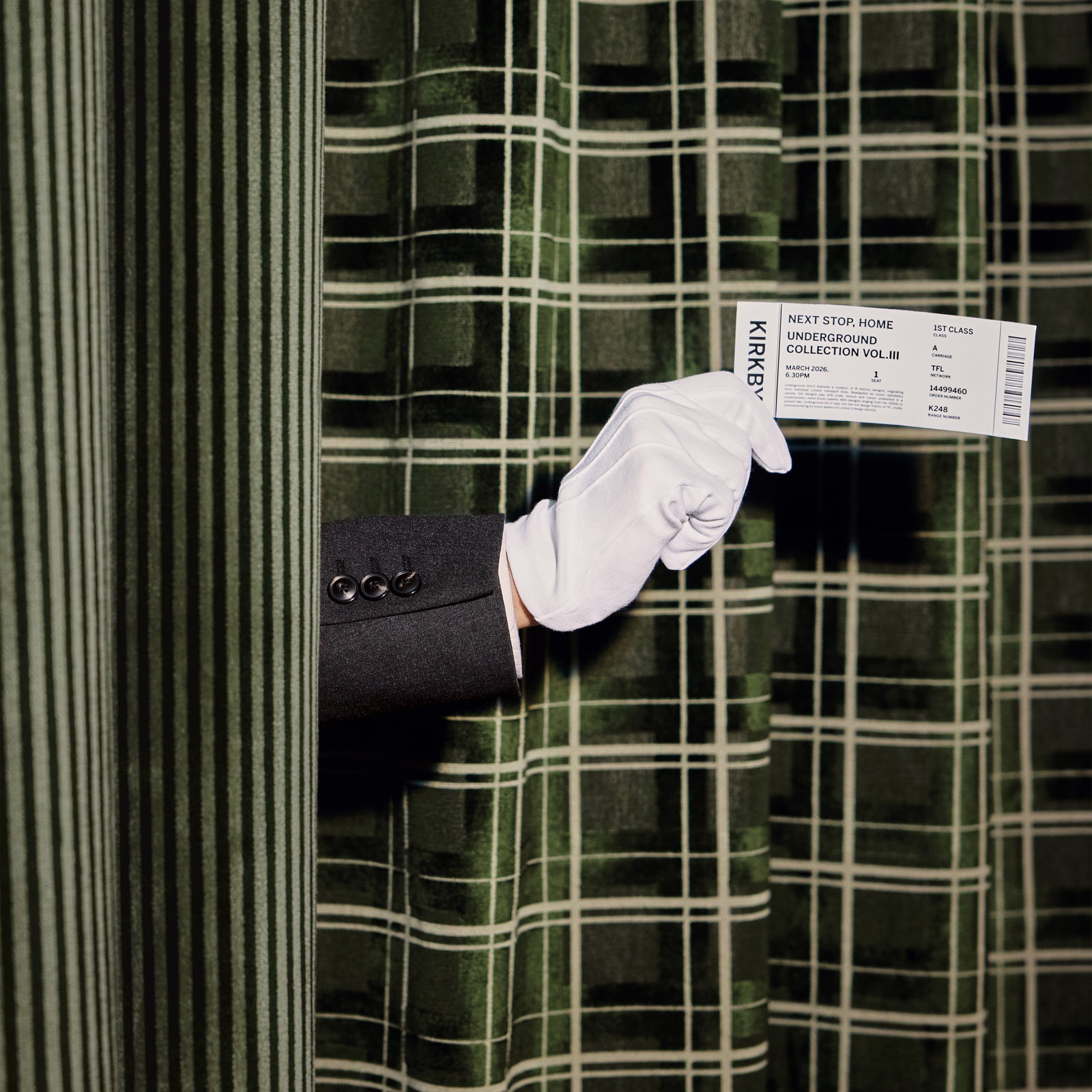 Deep pine-green plaid fabric with pale grid lines and softly folded texture
