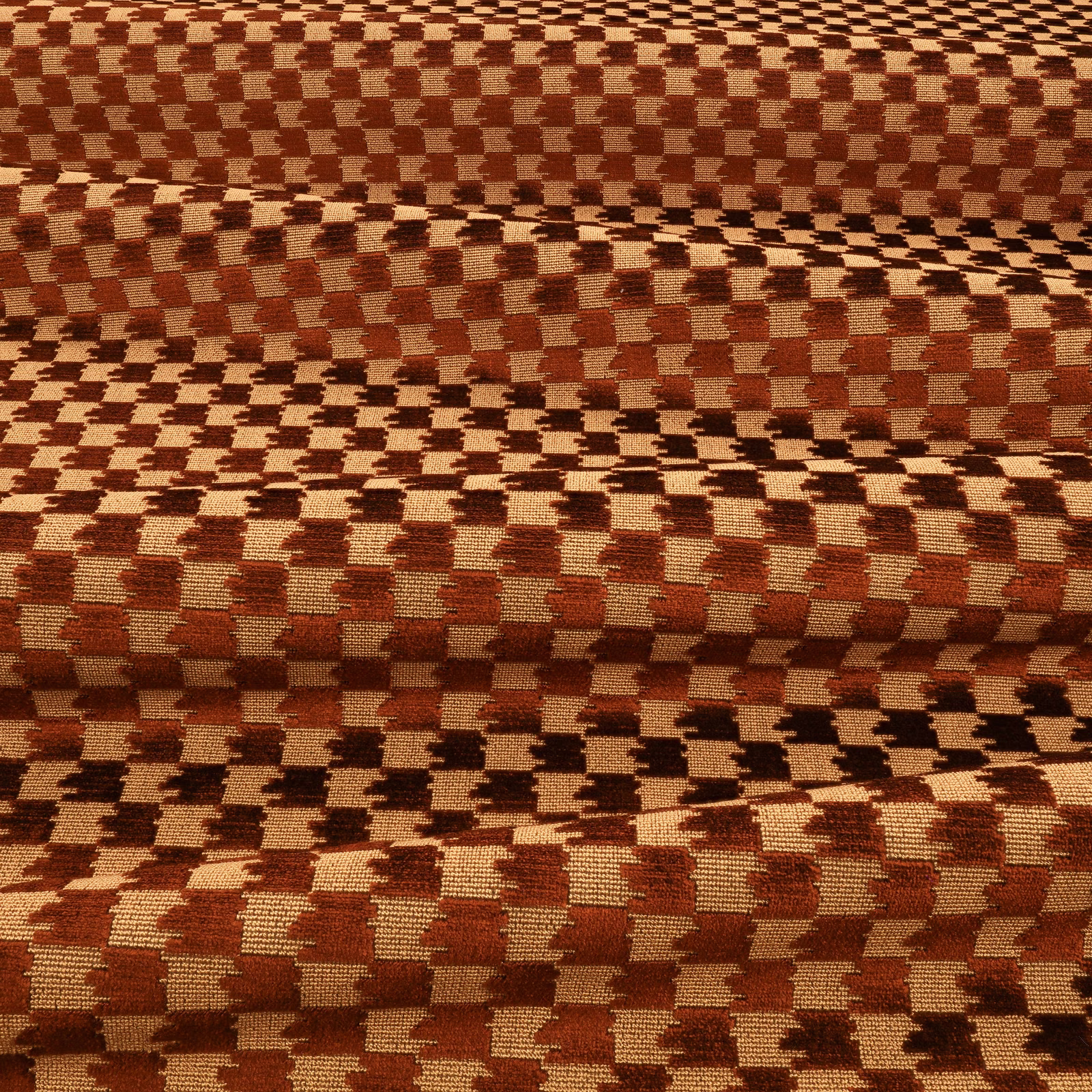 Close-up of Eden Ganache's rust-brown and cream broken-check woven texture