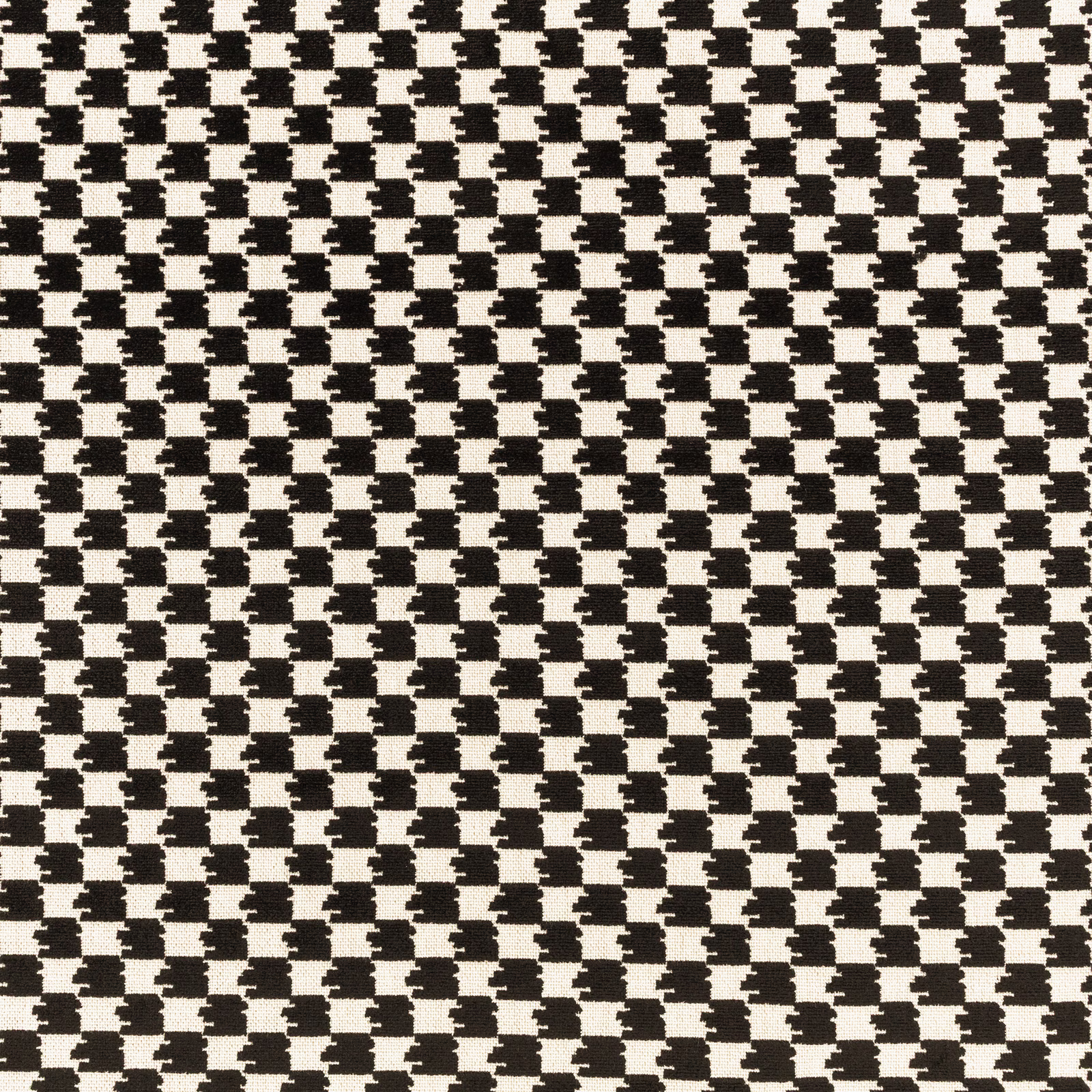 Black and cream woven geometric check fabric with irregular compact blocks