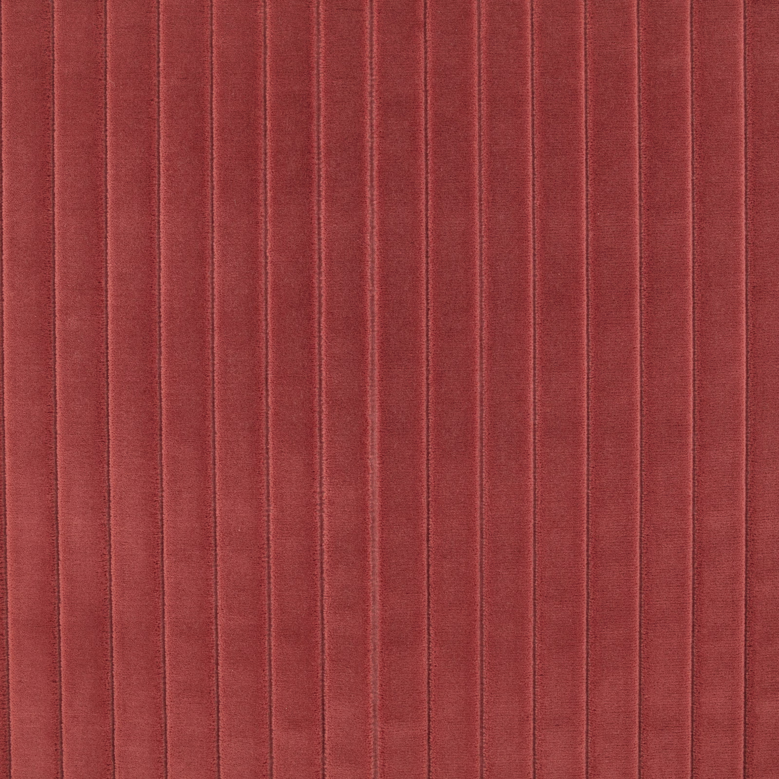 Warm paprika-red ribbed fabric with narrow vertical channels and subtle pile shading