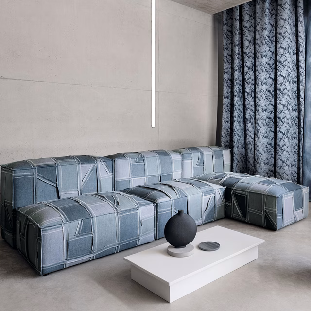 Cool denim-blue patchwork grid upholstery on a modular contemporary sofa