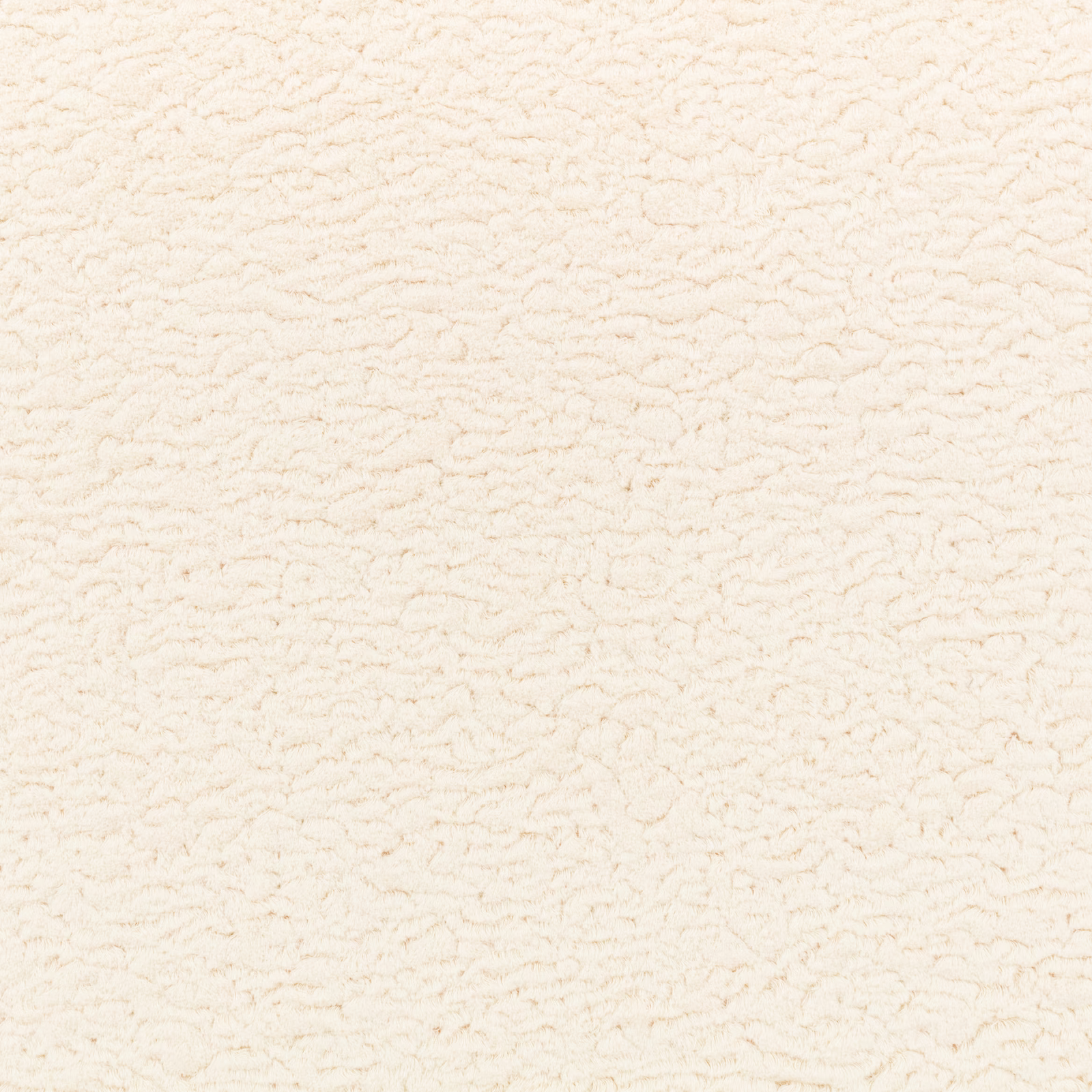Close-up of porcelain cream upholstery fabric with fine irregular looped texture