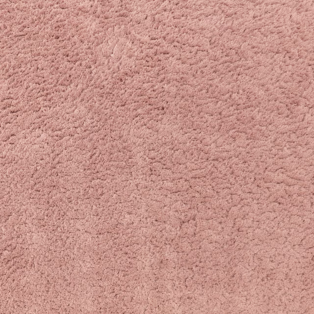 Close-up of muted vintage rose fabric with dense, softly ridged pile