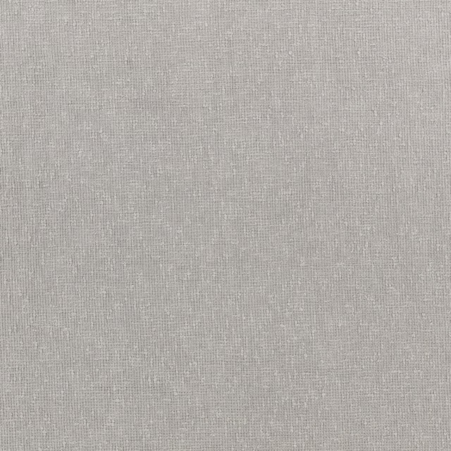 Close-up of pale cool-grey Utility Gris with a fine irregular woven texture