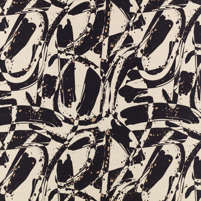 Cream and black abstract brushstrokes with scattered ink-like flecks