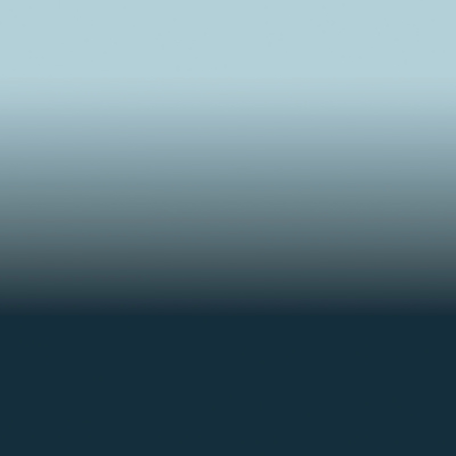 Pale aqua fading through blue-grey to deep teal-blue in a smooth ombré field