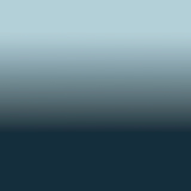 Pale aqua fading through blue-grey to deep teal-blue in a smooth ombré field
