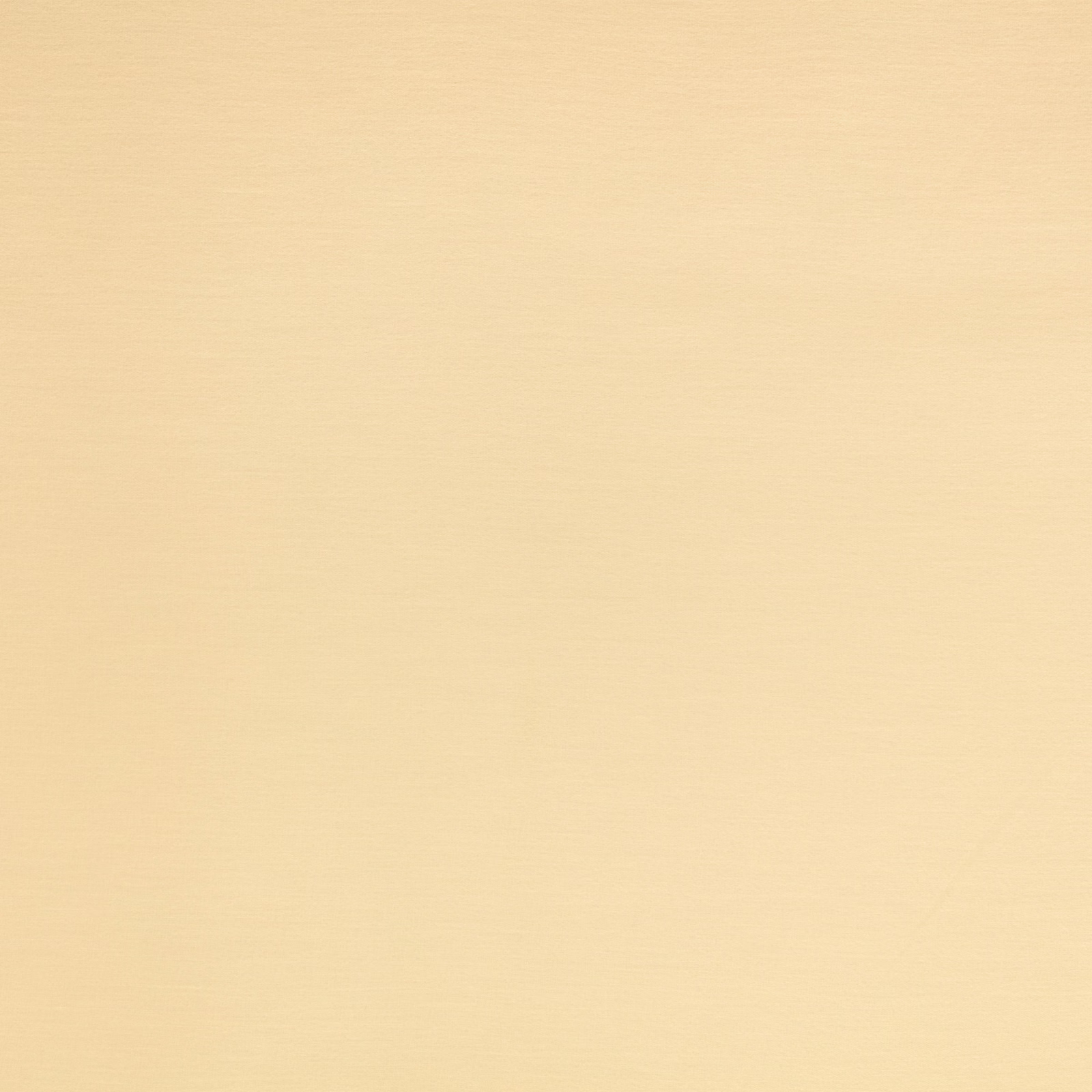 Pale buttery-yellow fabric showing a fine, subtly textured woven surface