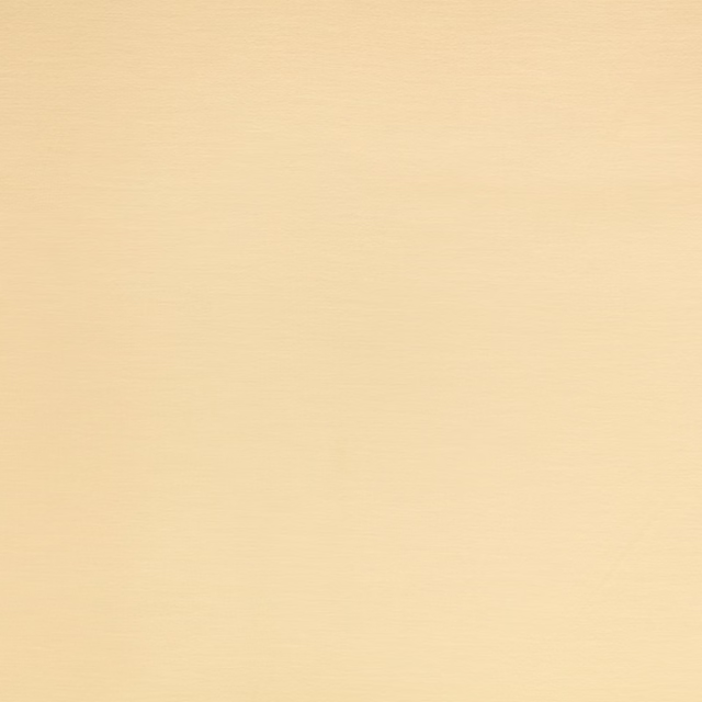 Pale buttery-yellow fabric showing a fine, subtly textured woven surface
