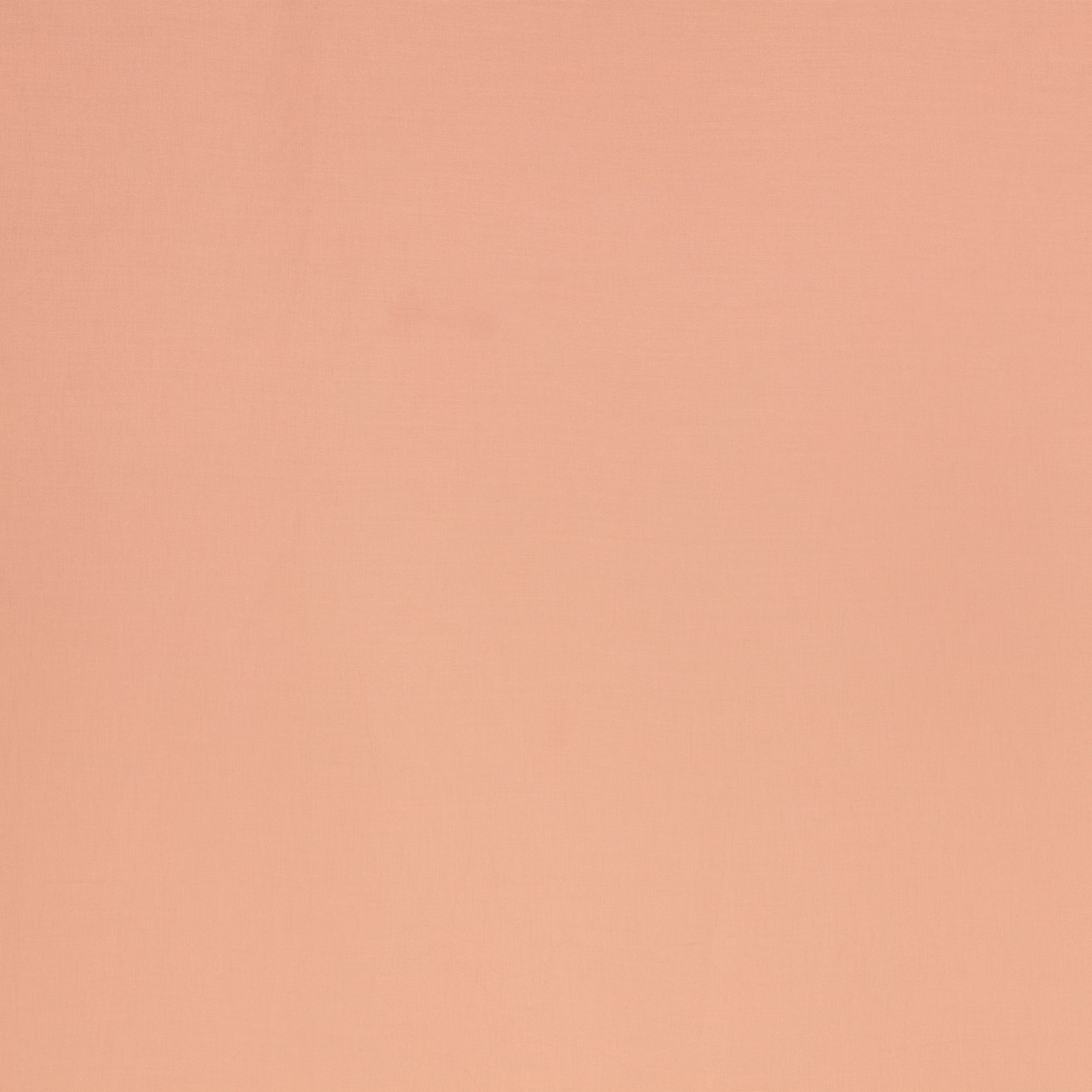 Warm dusty rose fabric swatch with a fine, subtly woven plain texture
