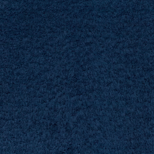 Close-up of dense midnight-blue brushed fibres with softly mottled dark texture