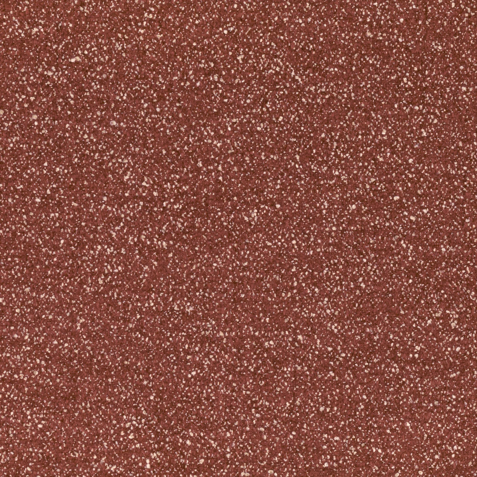 Close view of Ember Brick’s brick-red textile with dense pale flecking