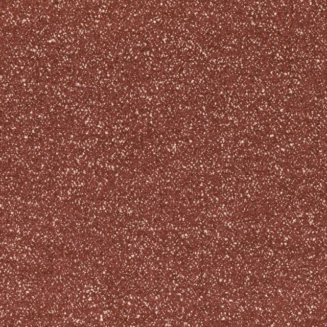 Close view of Ember Brick’s brick-red textile with dense pale flecking