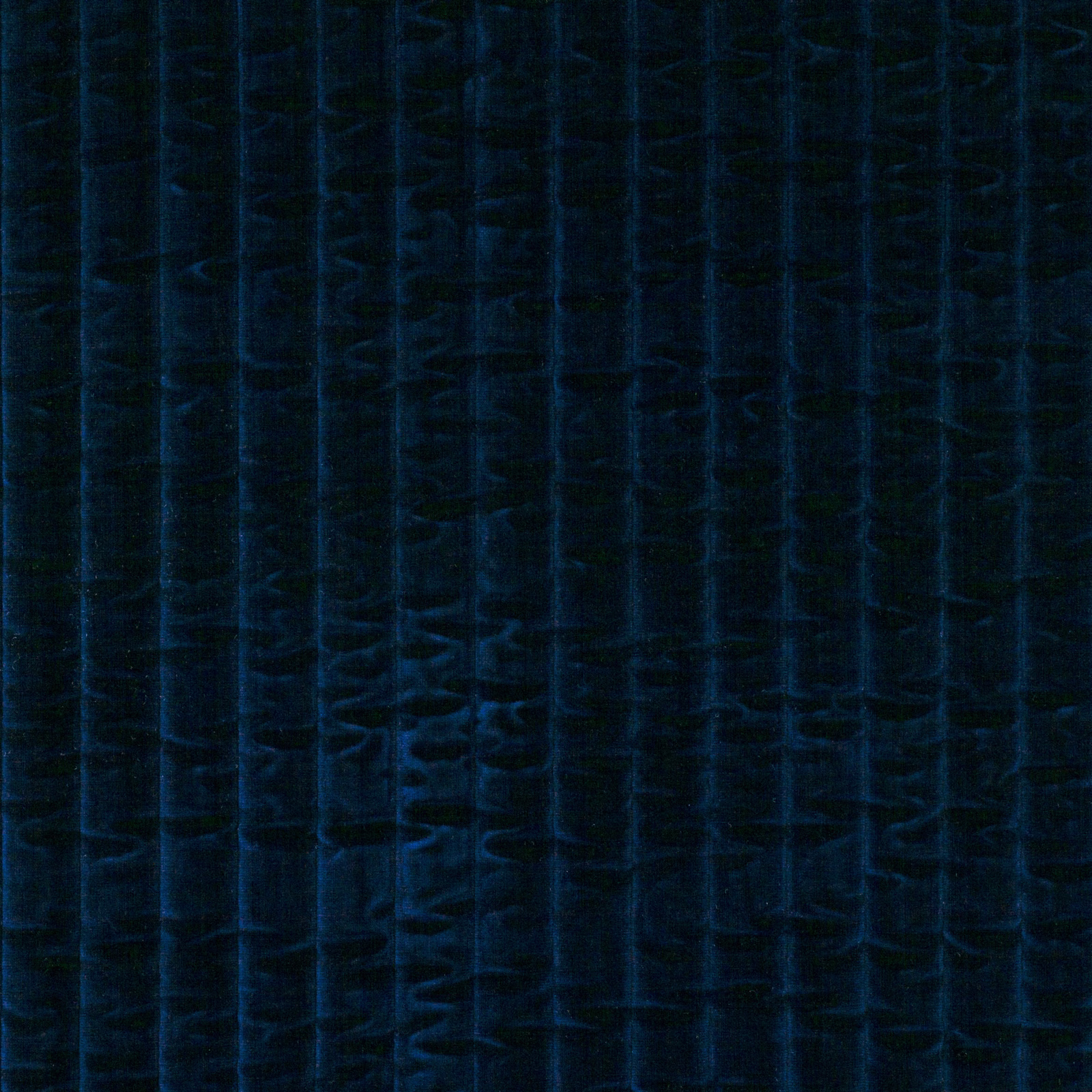 Midnight navy jumbo cord fabric showing broad shaded vertical ribs and tactile texture
