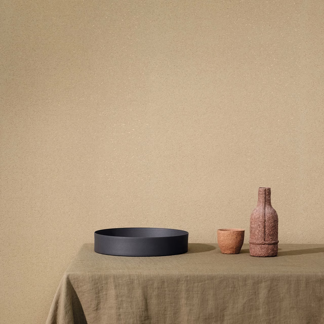 Warm sand-beige wallcovering with a softly mottled textured surface