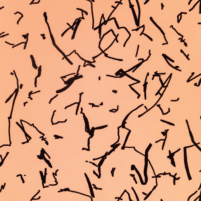 Warm amber-peach wallpaper with scattered black abstract scribbles and gestural marks