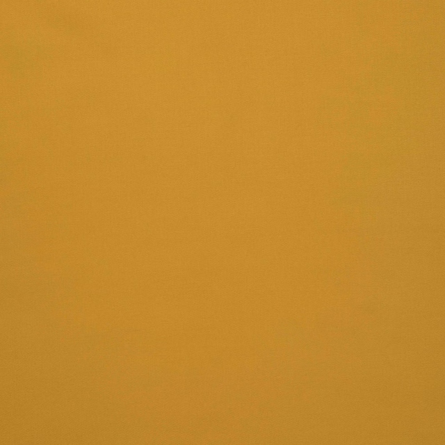 Close view of warm mustard-gold plain weave with a softly muted surface