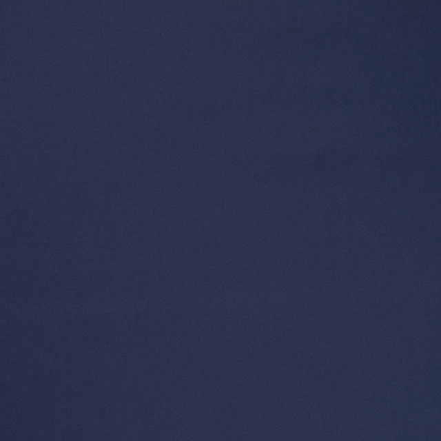 Deep indigo woven fabric with a softly mottled, low-sheen surface