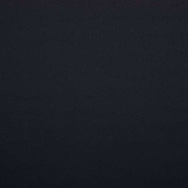 Near-black charcoal fabric with a fine, subtly textured matte weave