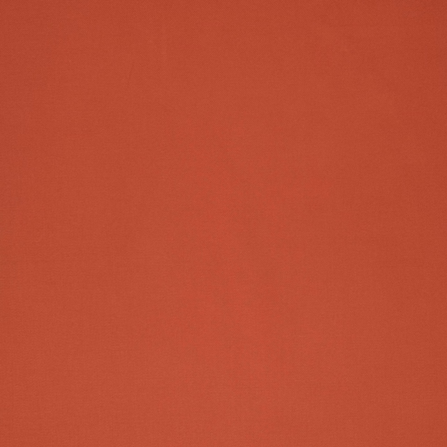 Warm red-orange terracotta fabric with a subtle fine plain weave texture