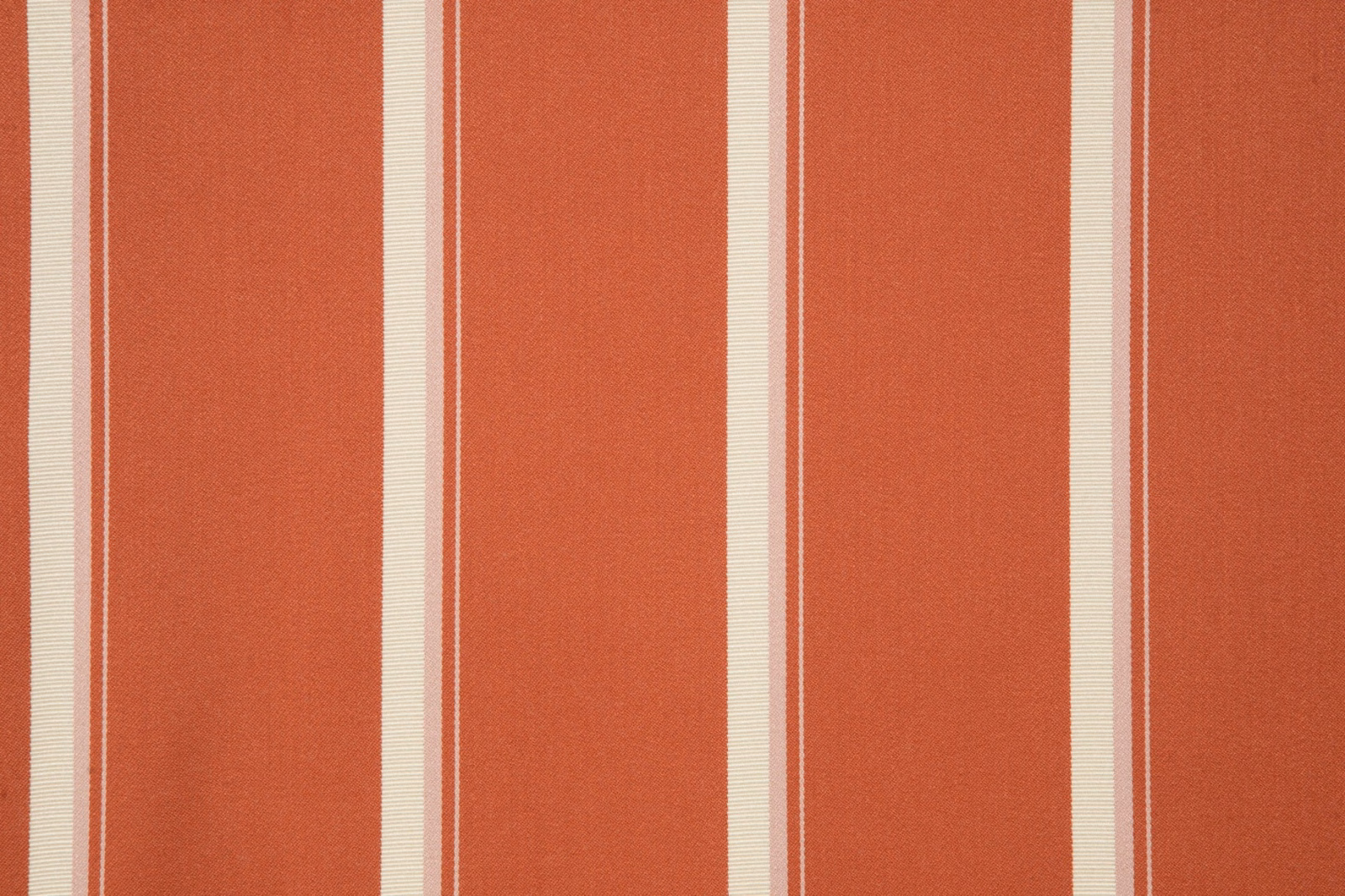 Warm paprika terracotta fabric with broad vertical stripes and slim cream bands