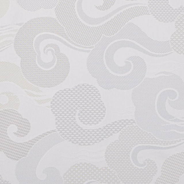 Pale ivory textile with cool grey scroll motifs and varied woven textures