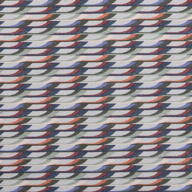 Muted sage woven fabric with repeating navy, slate and rust curved motifs