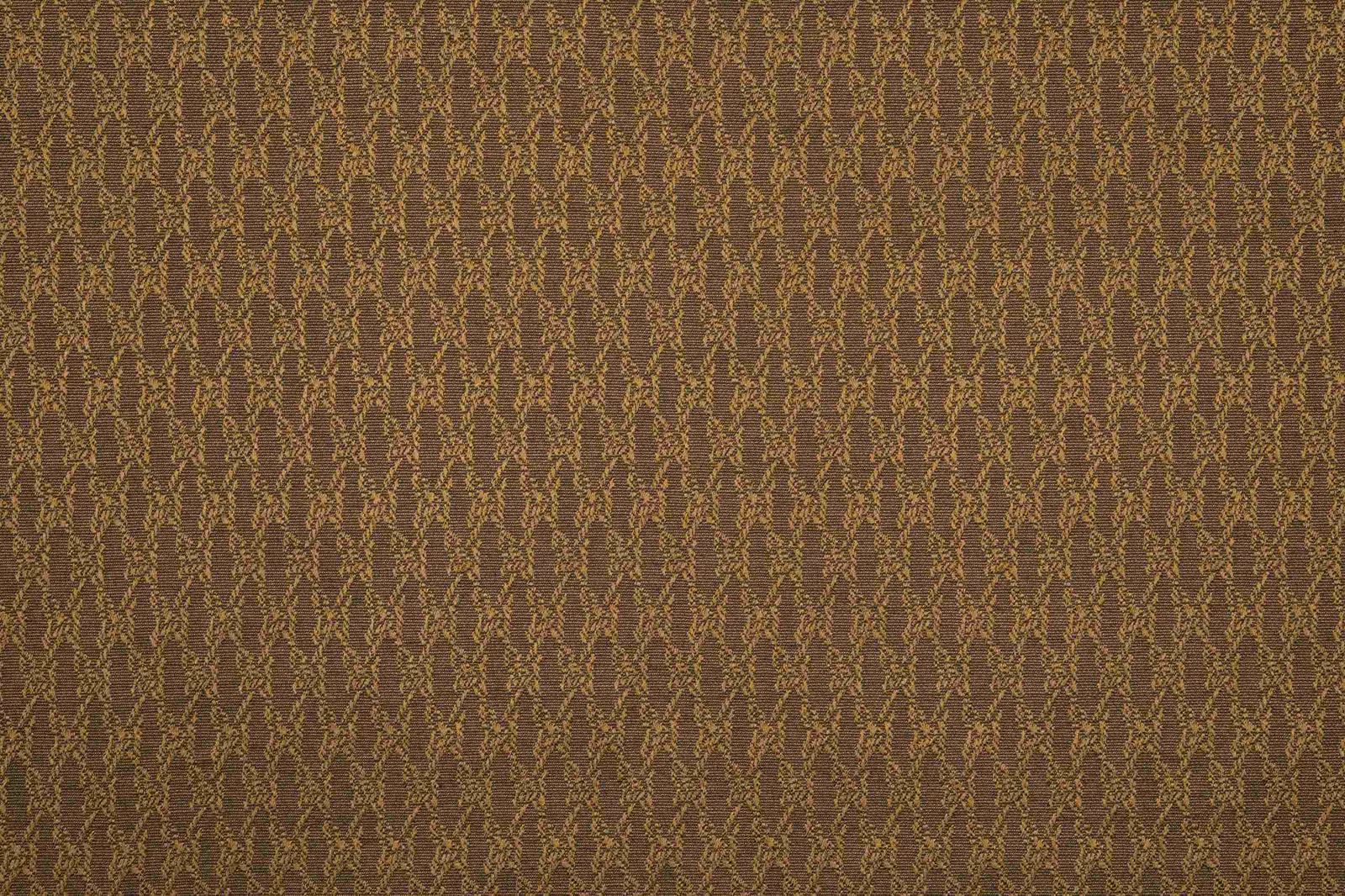 Bronze-brown textile with fine gold-olive vertical branching motifs and a close woven texture