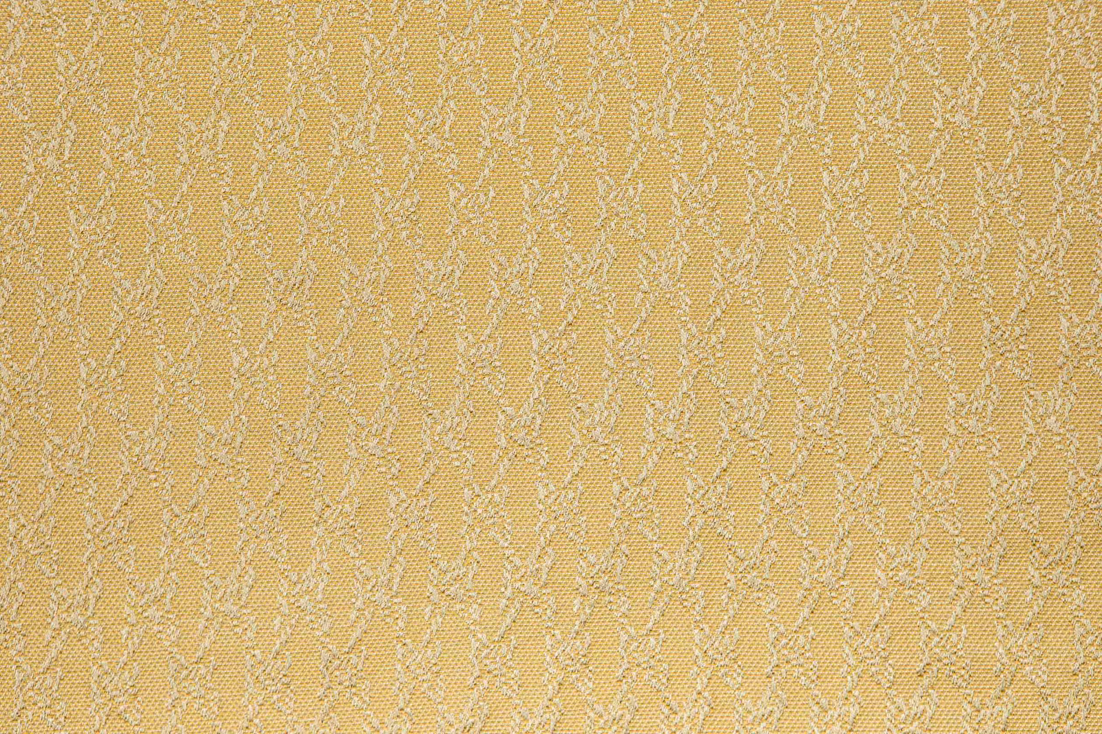 Warm golden woven textile with fine pale meandering vertical lines