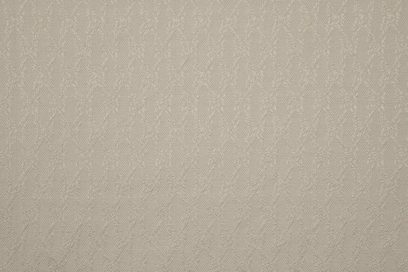 Pale natural taupe woven fabric with a barely visible vertical organic motif