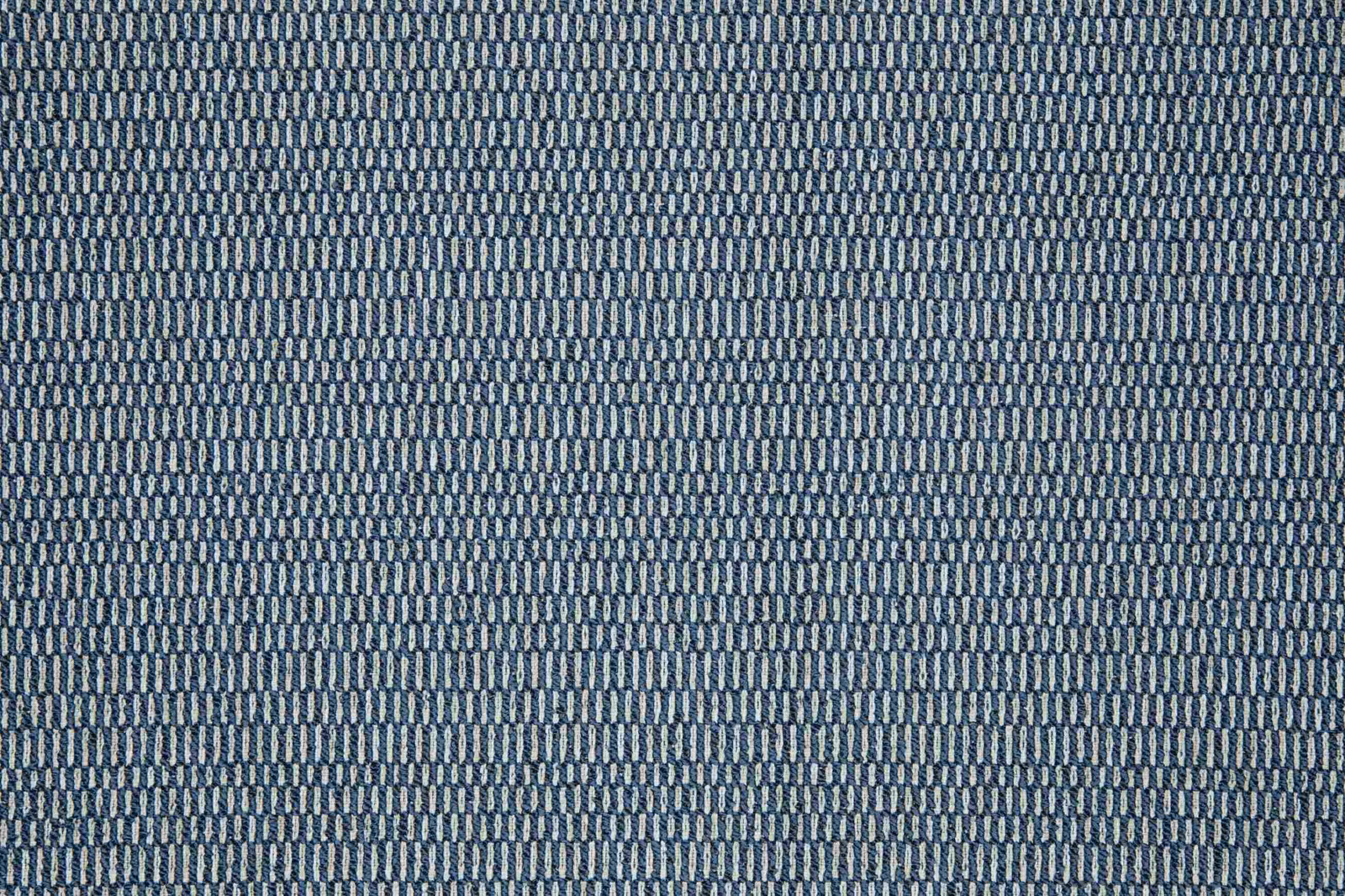 Close-up of muted ocean-blue textile with fine grey vertical woven marks