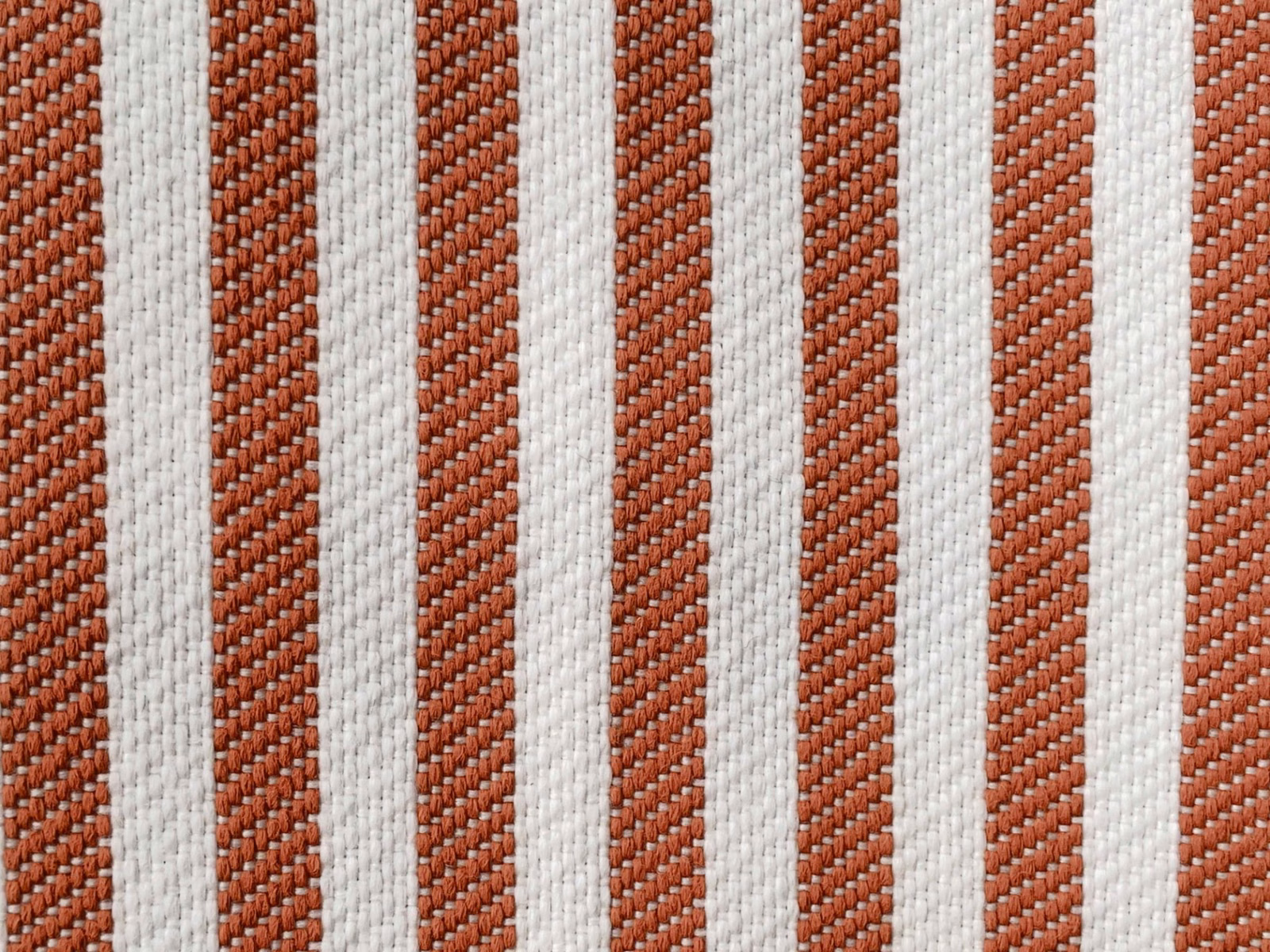 Close-up of terracotta and ivory vertical stripes with a ridged woven texture