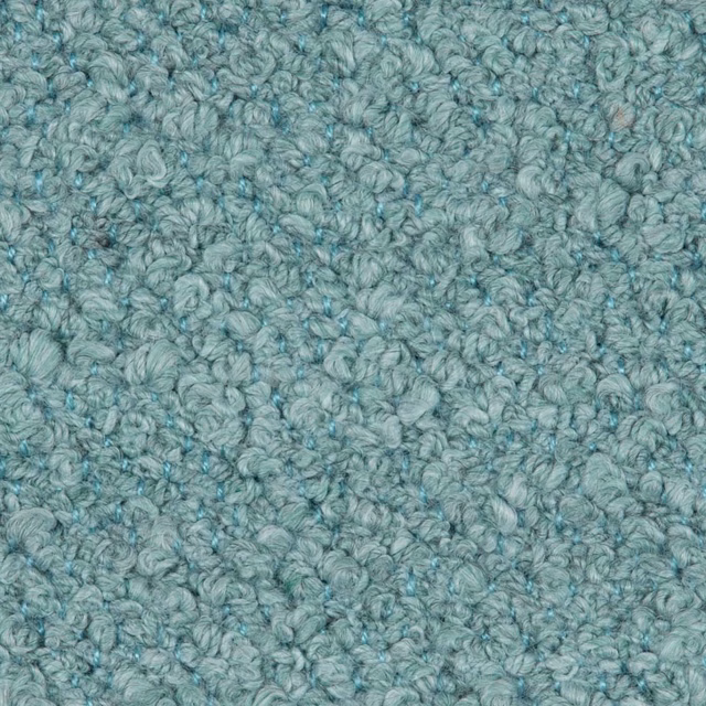 Close-up of soft aqua-teal looped texture with mottled blue-green depth