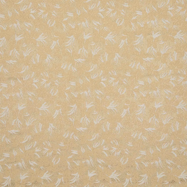Warm golden-beige woven fabric with scattered fine white botanical sprigs