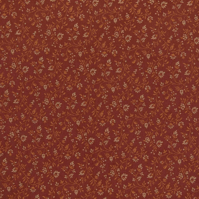 Mahogany-red textile with tiny muted-gold floral sprigs and winding vines