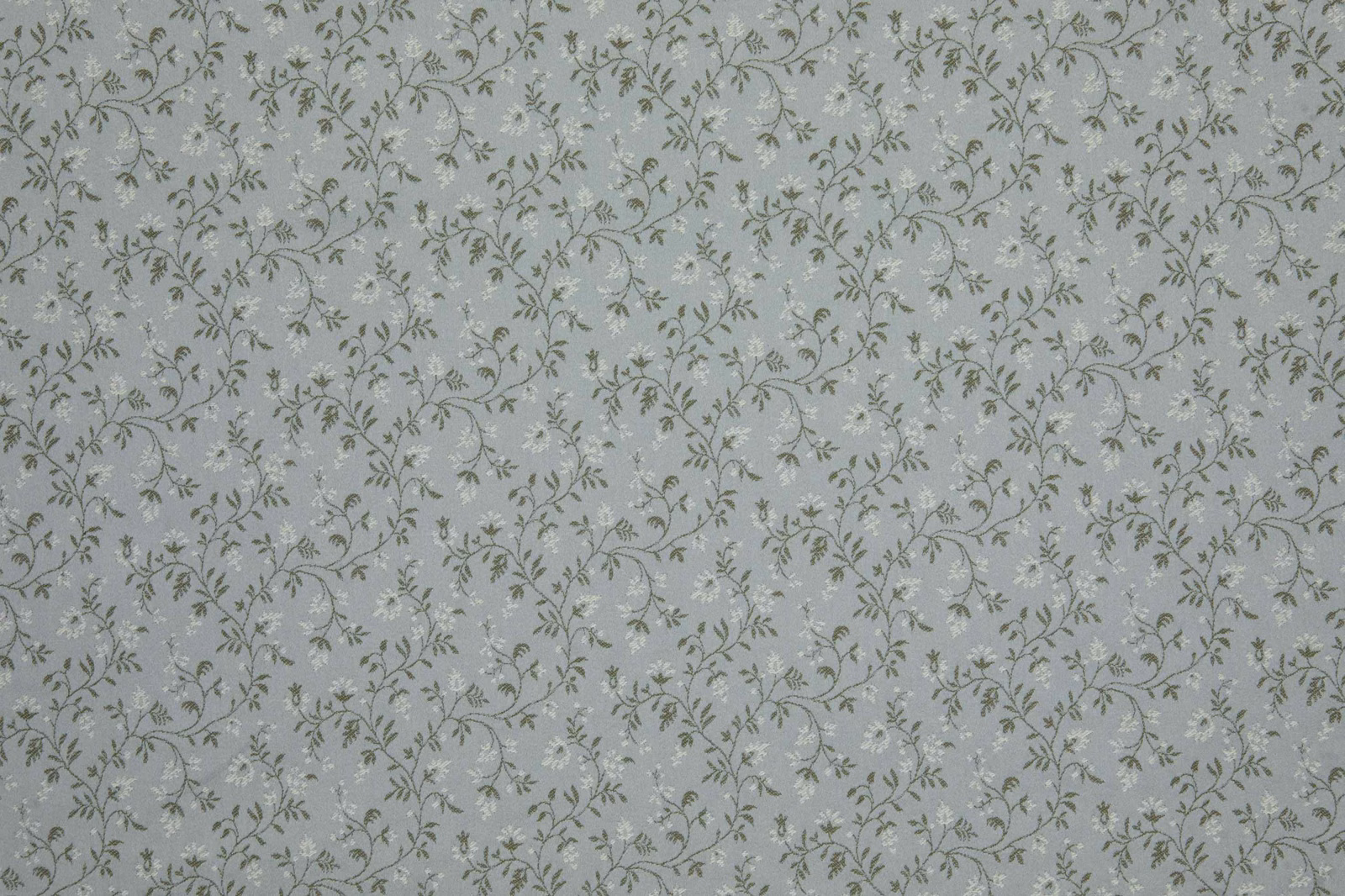 Cool sage-grey fabric with fine olive botanical vines on a pale ground