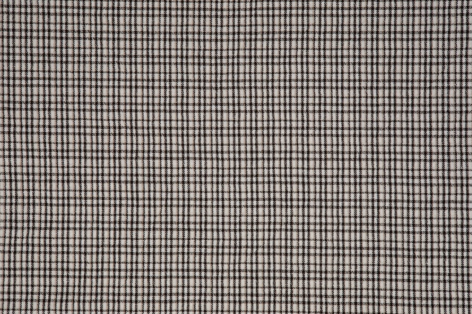 Black and ivory woven check with fine intersecting lines and subtle texture
