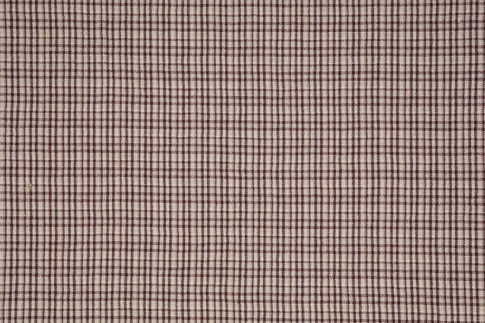 Fine burgundy and cream woven check with a softly irregular grid texture