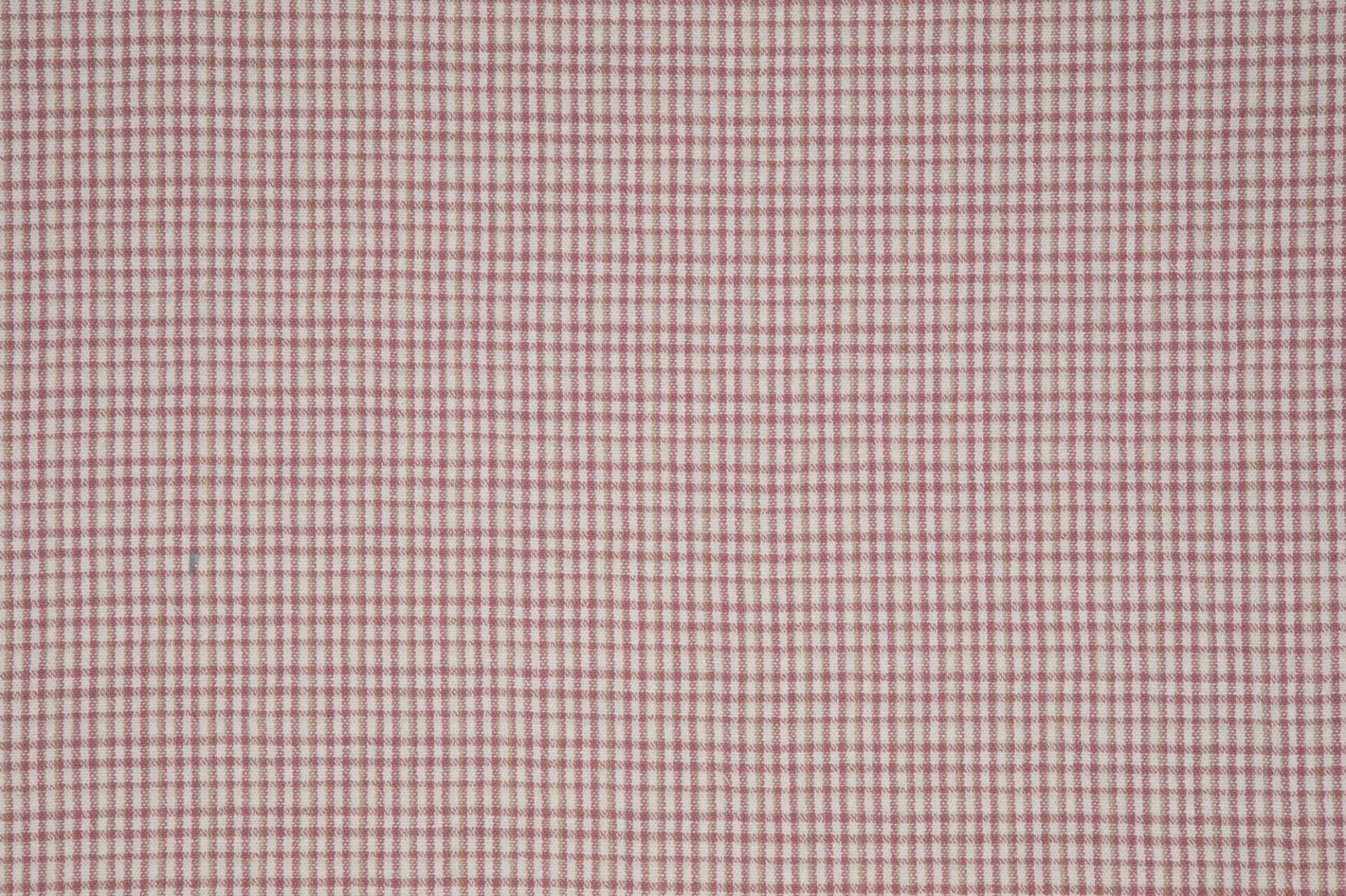 Pale petal-pink and ivory woven fabric with a fine, closely spaced check