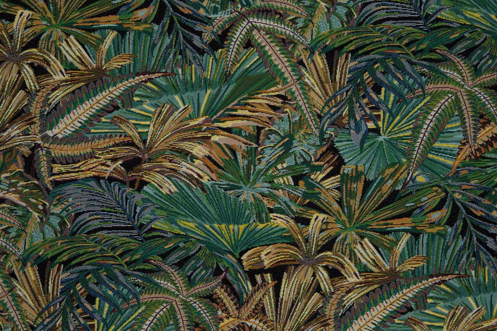 Dense tropical foliage in deep green, teal, olive and ochre woven texture