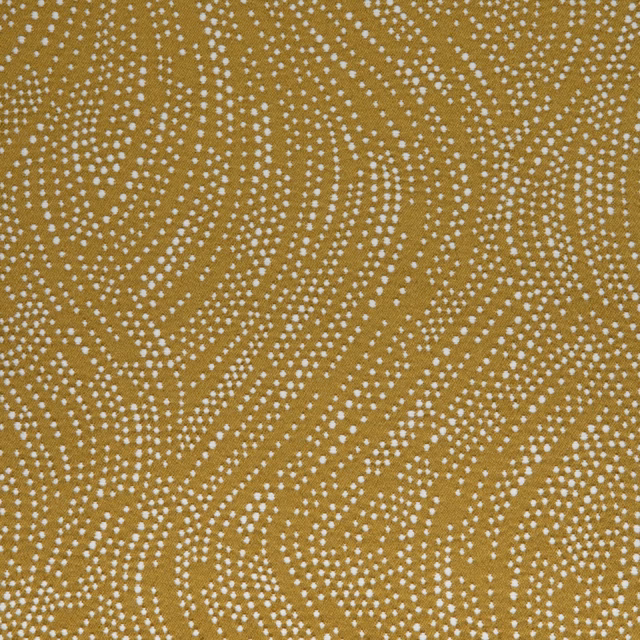 Muted ochre textile with ivory dotted trails in flowing organic waves